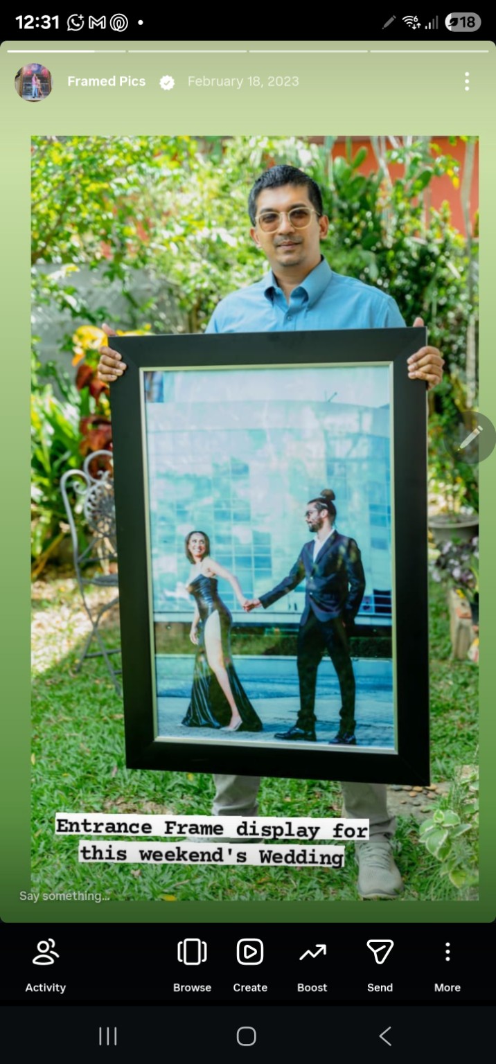 A framed full-size couple portrait prepared for a wedding entrance