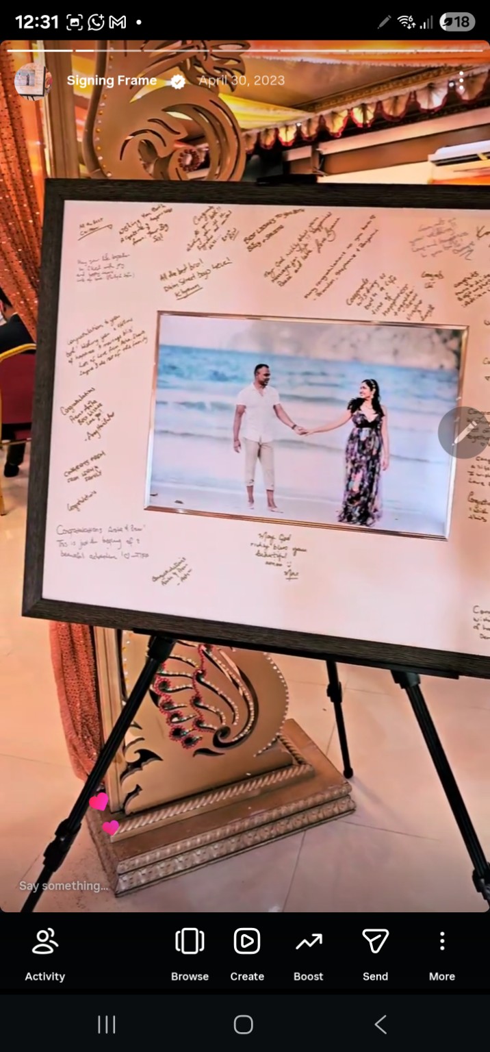 Framed couple's photograph surrounded by handwritten wedding wishes